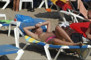 Girls on a nude beach in Sitges, Spain