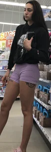 Lavender spandex shorts on a brunette thot with long black nails