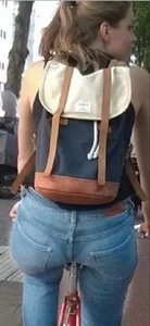 Blonde girl on a bike with a big tight ass in tight jeans