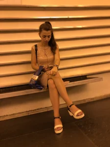 Girl Sitting Cross-Legged Public Candid Photo