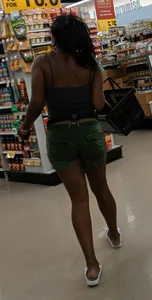 Ebony chick grocery shopping in green shorts