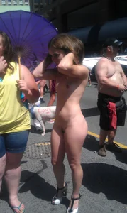 Nude small boobed girl at Toronto pride parade with a couple bonus girls