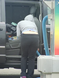 Girls cleaning their cars in jeans and pants