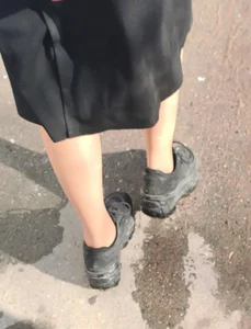Street Closeup Creepshot of a Teen Girl's Feet in Pantyhose And Dirty Sneakers