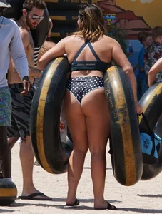 Girls in bikinis getting ready for tubing