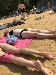 Hot Girls in Swimsuits Lying on a Beach Gallery