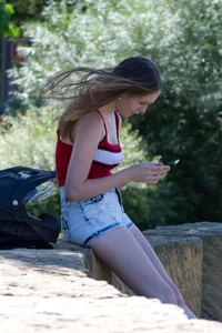 Pretty candid girls with nice legs sitting in denim shorts