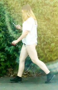 Thick girl in little shorts showing her cheeks