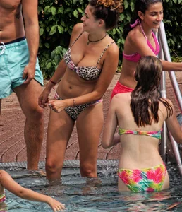 Hot big boobed girl in bikini at the pool