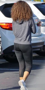 Beautiful black girl in Nike leggings in the parking lot