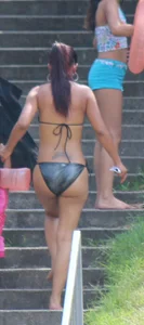Sexy brunette milf in a bikini with a great body, nice ass and some camel toe