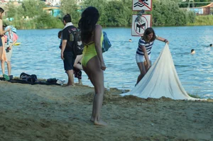 Sexy Girl in One-Piece Yellow Swimsuit Walking on the Beach Candid Photo Gallery