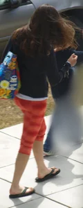 Beautiful brunette teen in orange patterned leggings