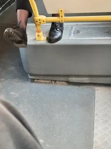 Female legs in boots public bus creepshot