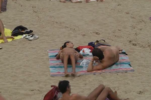 Topless girls on a beach in Barcelona