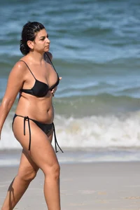 Thick mature brunette bikini lady on the beach with a nice body