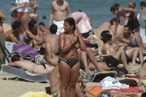 Topless girls on a beach in Barcelona
