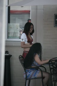 Two sexy Tilted Kilt employees showing cleavage and cheeks