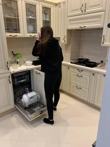 Girl in Leggings and Socks in a Kitchen Home Photo