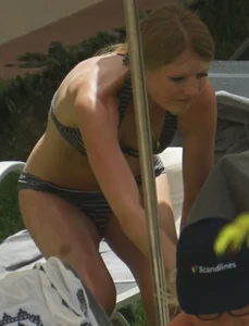 Skinny girl laying out in her bikini has pussy lip slip