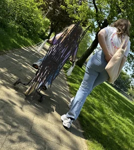 Hot milf's ass in tight blue jeans, creepshot at the park