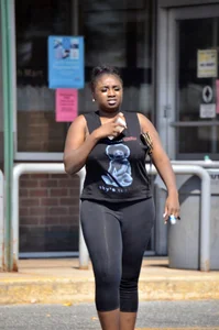 Chubby black lady with big tits and no bra lets it slip