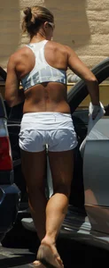 Fit babe in white shorts with big boobs in athletic top