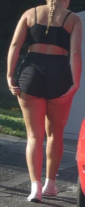Girl in shorts bends over