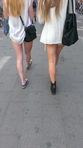 Street girlfriends in short dresses