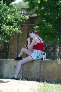Pretty candid girls with nice legs sitting in denim shorts