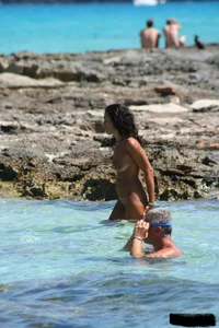 Nude beach ladies in the water showing their tits