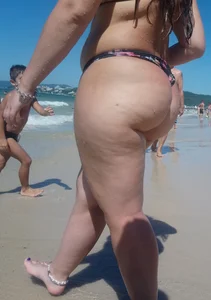 Fat ass milf at the beach in a thong bikini