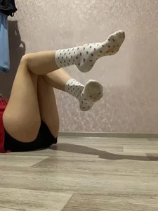 Girl Lying on the Floor Showing Feet in Socks Home Selfie