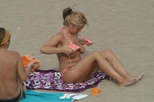 Topless girls on a beach in Barcelona