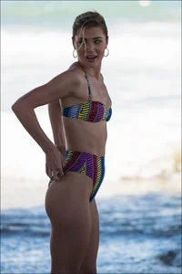 Beach girl with an incredible body in a funky looking bikini