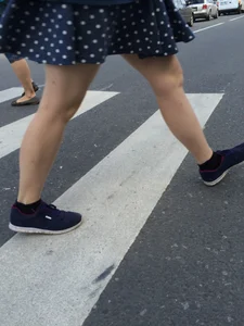 Girl in Polka-Dot Skirt with Pale Legs Crossing the Street City Candid