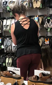 MILF in red leggings bends for the camera