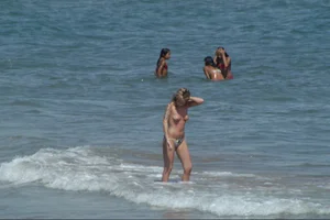 Girls on a nude beach in Sitges, Spain