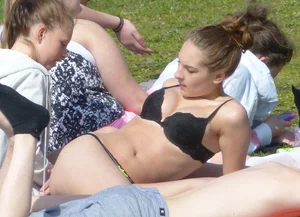Teen in her underwear at a beach park with a nice ass in thong