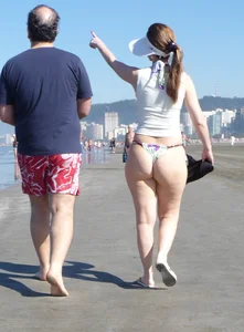 Big booty beach babe in thong bikini