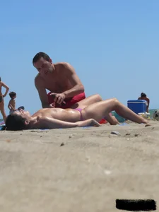 Purple thong topless lady on the beach gets oiled up by her husband