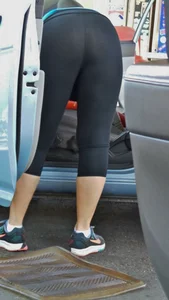 Girl in tight see through leggings with nice ass cleaning her car
