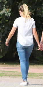 Blonde chick walking with her boyfriend in tight jeans