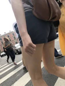 Young Girl in Shorts And Sandals Crossing the Street Gallery
