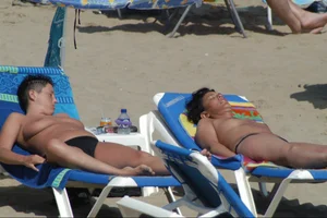 Girls on a nude beach in Sitges, Spain