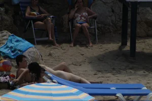 Girls on a nude beach in Sitges, Spain