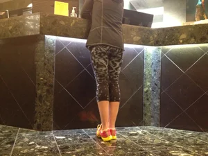 Nice Flat Butt And Legs in Short Tights at a Hotel Reception Desk