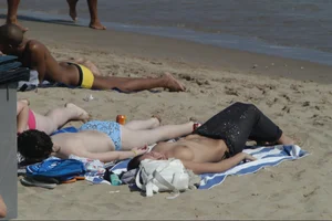 Girls on a nude beach in Sitges, Spain