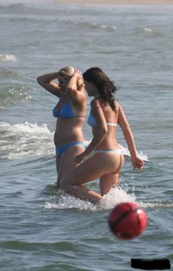 A bunch of sexy beach voyeur babes in bikinis, thongs and topless