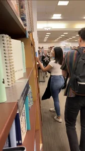Pretty babe in tight jeans showing nipples in book store w bf (Not OC)(Face shot)